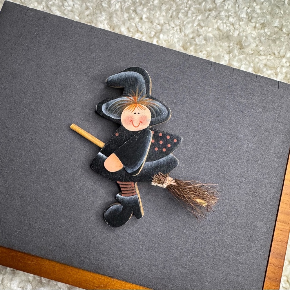 6. Crazy Mountain Charming Witch Brooch - Black and Brown